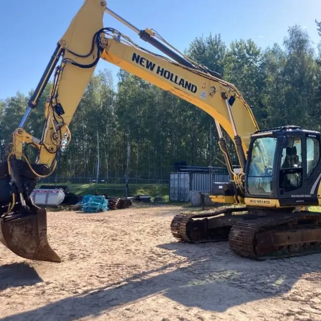 تصویر شاخص  اجاره بیل مکانیکی زنجیری new holland نیوهلند 215  با چکش هیدرولیکی ( پیکور )